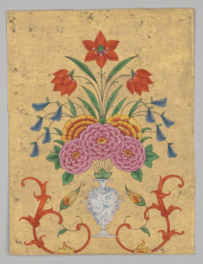 Vase with flower arrangement and scrollwork